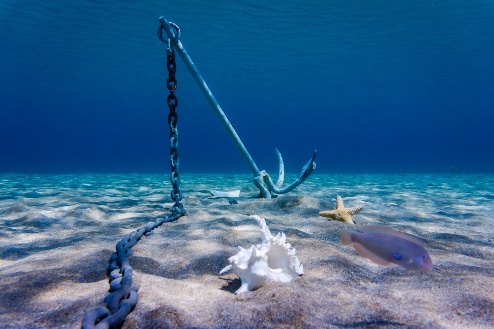 Anchor laying on the bottom of the ocean