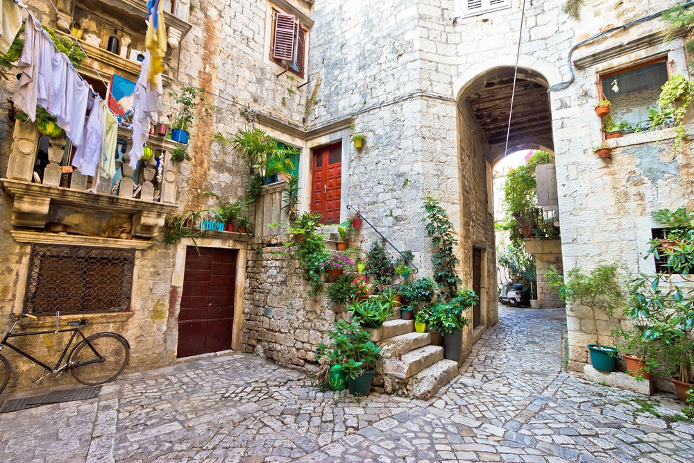 Old stone street of Trogir UNESCO world heritage town in Dalmatia, Croatia