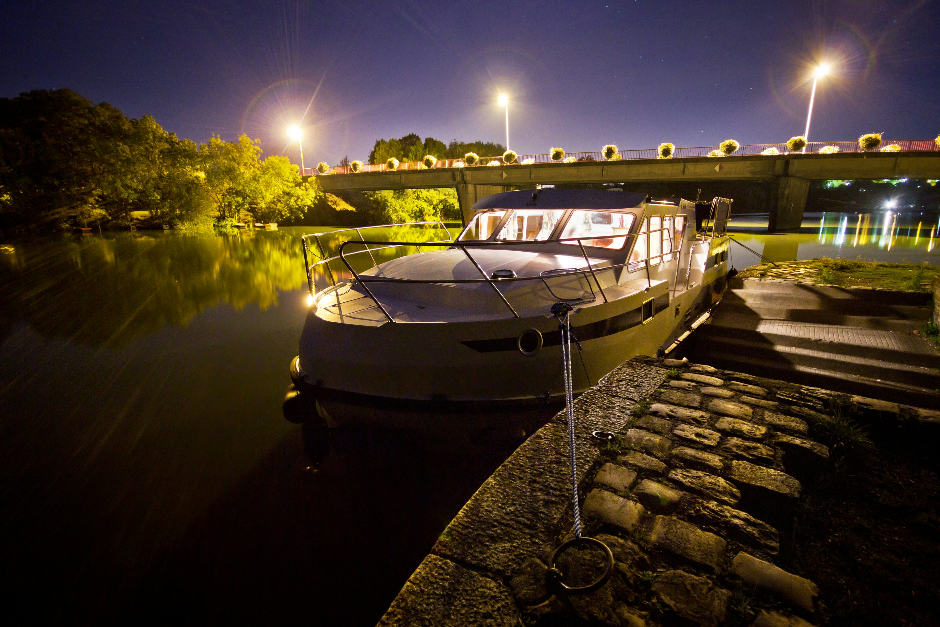 Houseboat anchored at night