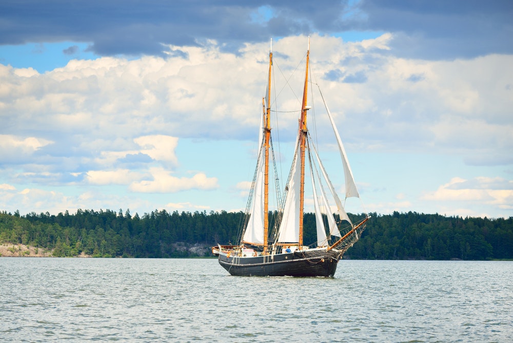 An elegant two-masted gaff schooner (training tall ship) sailing in Mälaren lake, Sweden. 