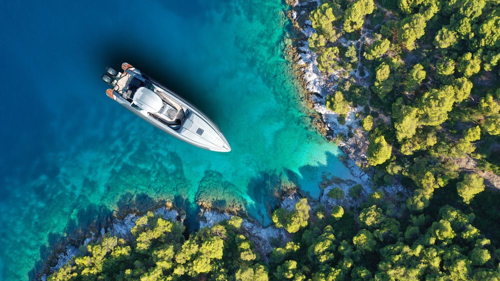 Speed boat anchored in tropical exotic island